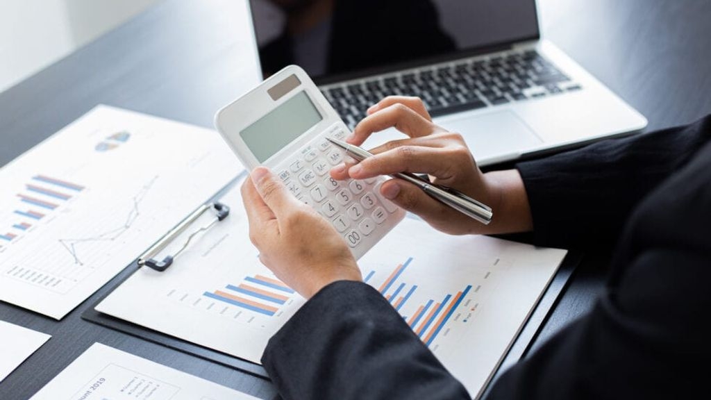 An accountant using a calculator